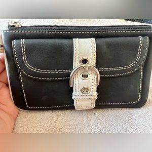 Black and white Coach wristlet